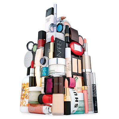 A tower of cosmetics is stacked on top of each other.